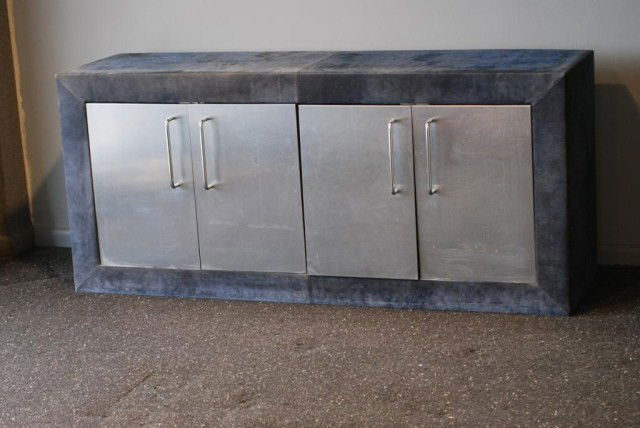 PAUL EVANS BLUE SUEDE 4-DR.CABINET: Blue suede exterior with 4-metal doors, 32"h x 72 1/2"w x 20"d. Normal wear for a piece of this age, otherwise in good "as found" condition.