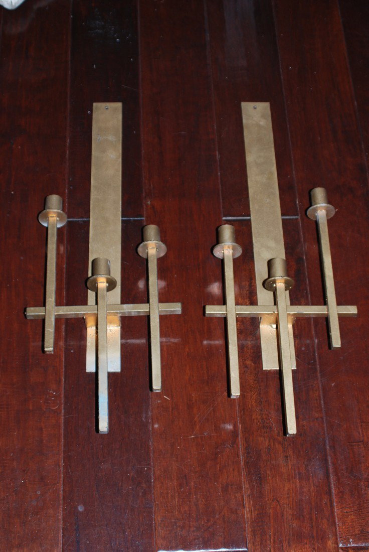 PAIR OF MODERN DESIGN SCONCES: A pair of gilt metal three arm wall sconces. A proper pair of a right and left. 25"H X 9"W. In good condition.