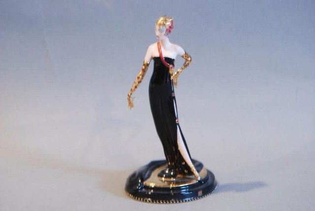 HOUSE OF ERTE PORCELAIN STATUE "UNTAMED BEAUTY": 9"h x 5"w x 4 1/2"d. Two fingers on the right hand have losses, otherwise in good condition.