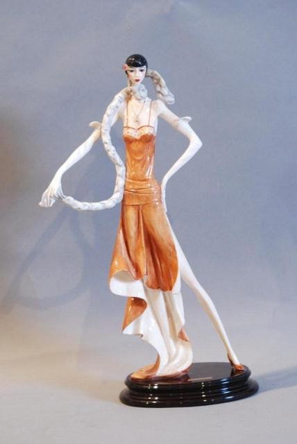 "LADY IN A BROWN FLAPPER DRESS w/DOG BY A.SANTINI: Art Deco style, on a wooden base, 18 1/2"h x 12"w x 5"d. In good condition.
