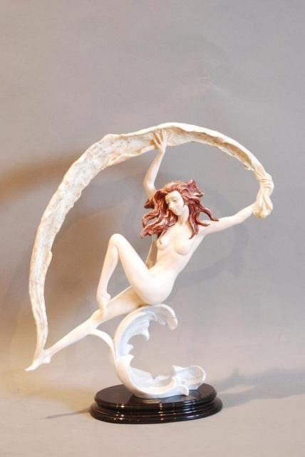 STATUE OF A NUDE WOMAN w/RIBBON BY A. SANTINI: On a wooden base, 19"h x 17 1/2"w x 6 1/2"d. In good condition.
