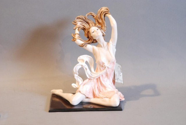 STATUE OF WOMAN w/UP DO BY A. SANTINI: On wooden base, 12"h x 10"w x 7"d. In good condition.