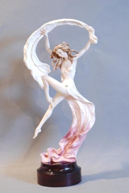 STATUE OF WOMAN w/RIBBON BY A. SANTINI: On wooden base, 27"h x 12"w x 7"d. In good condition.