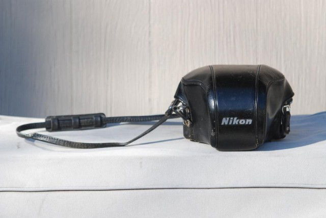 3PC. VINTAGE NIKON LOT: 1-35 MM Nikon Camera in leather case, 1-Nikkor-Q auto lens with leather case, 1-Nikkor-O lens with leather case.