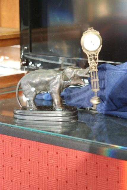 ELEPHANT FORM BRONZE "SWINGER" CLOCK: Bronze figure on a marble base. Swinger movement in tact and working. 10 1/4" H X 10" W X 6" D. 20th century. Some oxidation to the finish, otherwise good condition.