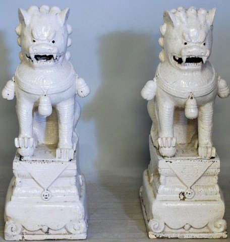 PR. CHINESE FOO DOGS: Glazed, ceramic Foo Dogs with distressed crackle finish and each with 2-parts, 39 1/4"H X 15 1/2"W X 20 1/2"D. Old repairs, otherwise in good condition.