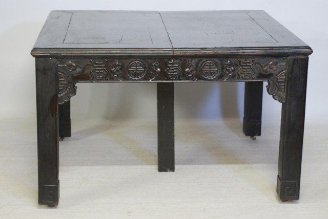 ANTIQUE CHINESE HARD WOOD DINING ROOM TABLE: Hard wood table with symbols carved on skirt. This table has good age, probable 19th century, 32 1/2"H X 53"W X 53"L, with 5-9 3/4" leaves and 1-7 3/4" leaf. The finish has normal wear and age cracks
