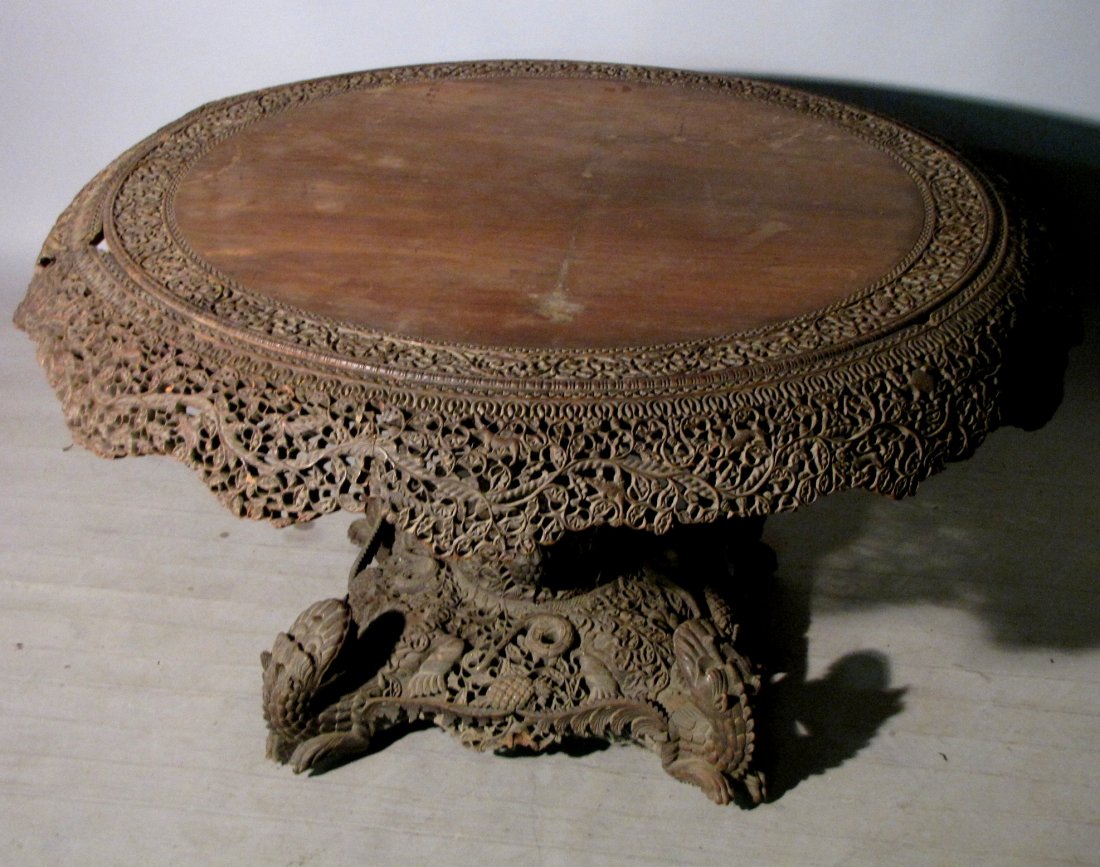 ANTIQUE BURMESE ORNATE CARVED CENTER TABLE: Extensive and meticulous carving, old finish with material losses and older repairs. Particularly unusual. Clearly missing sections & pieces, yet an intensely attractive & curious antiquarian piece. B