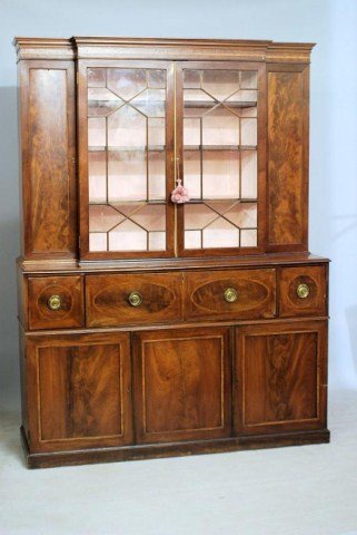 ANTIQUE ENGLISH GEORGIAN STYLE BREAKFRONT: Two-part mahogany Breakfront with rosewood banding and inlays. Top drawer of base is a drop-front butler's desk, 89"H X 67"W X 22"D. Minor losses and old repairs.