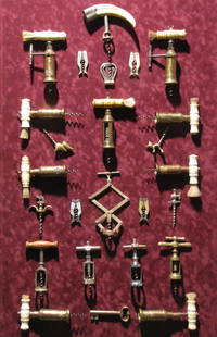 ANTIQUE CORKSCREW COLLECTION: Twenty five pieces, mounted against a red velvet background, framed in a sealed, wired, shadow box. 26" x 42" x 4" deep. Email us for additional pictures...!