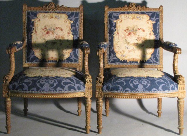 PAIR ORNATE LOUIS XVI STYLE WALNUT FAUTEUILS: This pair of gorgeous chairs are part of the same parlor set that came from the same estate, the other pieces are being sold separately; see lots #293 & #294. Tight well-assembled, solid frames with a