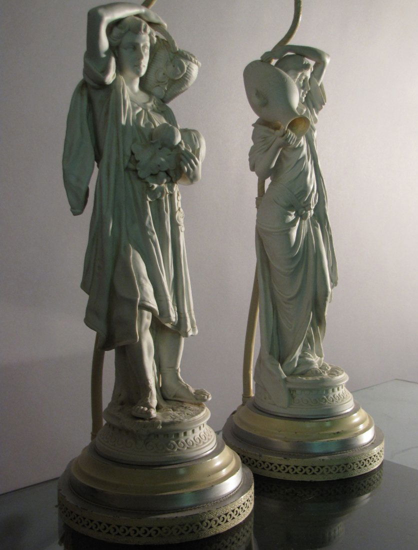 PAIR DECORATIVE PARIAN FIGURAL LAMPS: A woman with an urn and another with an amphora, traditional beauty and timeless quality, 8"base, 37"H. No chips, cracks, dings or bruises.