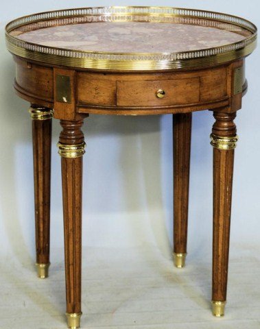LOUIS XVI STYLE MARBLE TOP BOUILLOTTE TABLE: Walnut Table with brass gallery and mounts, marble top, 1-drawer and 2-pullout trays, 27 1/2"H X 24 1/4"Diameter. In good condition.