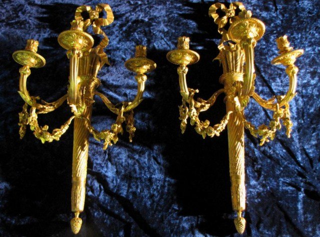 PAIR OF LOUIS XVI STYLE BRONZE SCONCES: Excellent attention to detail right down to details in the foliage and pineapples, 30"H X 17"W X 11"D. Bright and clean.