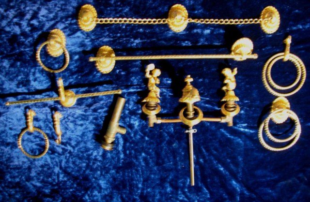 REGENCY BRASS FAUCETS BY SHERLE WAGNER NEW YORK: Extremely fine grouping of brass decorative bathroom accessories, clearly signed. Hot and cold faucets are 12" apart, towel bar is 24" and includes all items "as shown". Stylized escutcheons, elegant