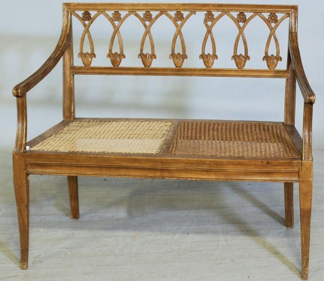 NEOCLASSICAL STYLE ITALIAN SETTEE: Walnut Settee with cane seat, 32 1/4"H x 38 1/2"W X 17 1/2"D. One side needs re-caning finished, piece of back splat return is missing.