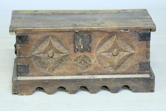 ANTIQUE ITALIAN DIMINUTIVE CASSONE: Walnut Cassone with metal corner bindings, handles and escutcheons, 16"H X 32 3/4"W X 14"D. Old worm damage consistent with a piece of this age and origin, otherwise in good condition.