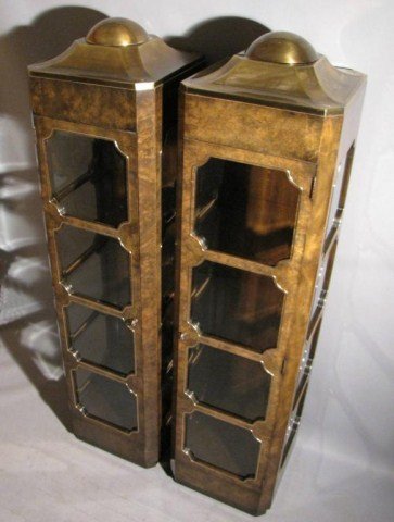 PR.MASTERCRAFT ARCHITECTURAL VITRINES: Not twins, but a matched left and right-handed cabinet, capped with brass rotunda, each case has twelve panes of beveled glass and three selves with ground plate edge across the back, 22" X 22" X 88"H