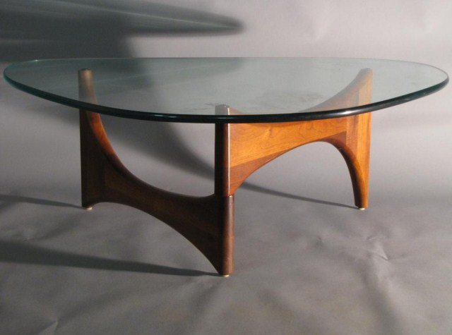 NOGUCHI STYLE AMORPHOUS COFFEE TABLE: Two-piece walnut 'hinged' base with slab of curved glass. Excellent style, elegant and attractive design with contemporary sophistication. Bright and clean with minimal wear.