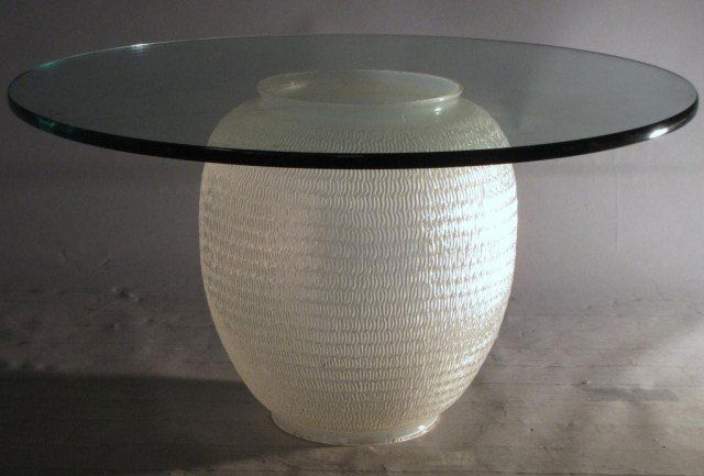OPALESCENT GLASS ROUND COFFEE TABLE: Unusual blown glass base and hand finished by factory grinding. Vaguely opalescent, we have yet to try it under exposure to a black light, 18" X 36". Other than light scuffs and scratches to the surfa