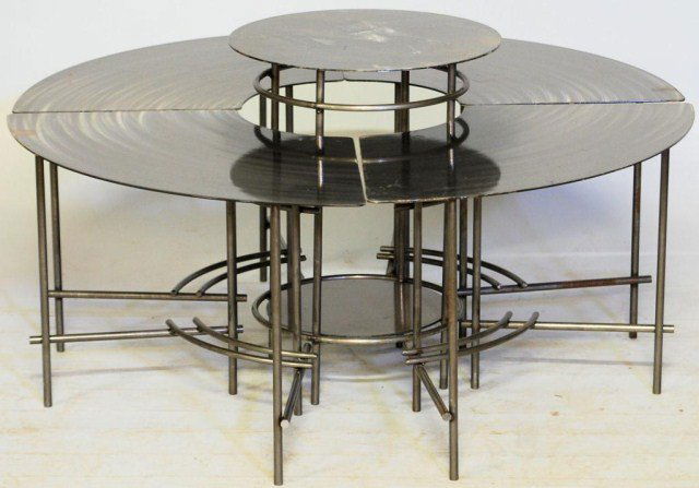5-PIECE MODERNISTIC FONDO SET: Brushed steel Set, round table and 4-curved chairs, 21"H X 38 3/4"Diameter. Minor oxidations, otherwise on good condition.