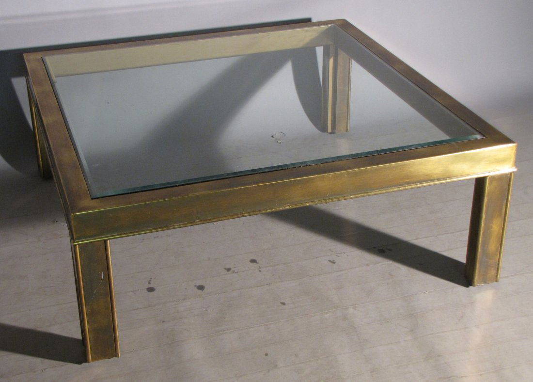 MODERNIST MASTERCRAFT COFFEE TABLE: Brass laminated wood, 16"H X 42"W X 42"D. In good "as found" condition.