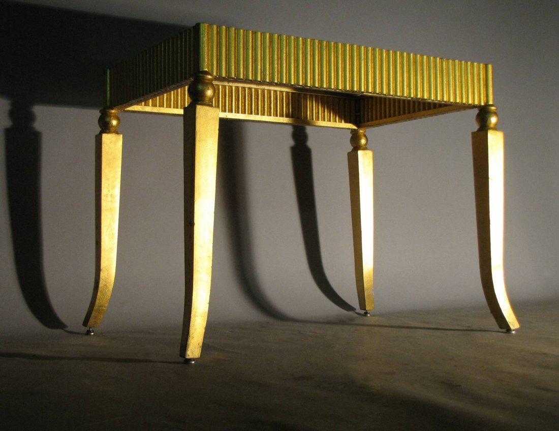 HOLLYWOOD REGENCY STYLE OCCASSIONAL TABLE: Cast metal base with faux gold gilt & mirrored top, very decorative and stylish, 24"H x 33"W X 22"D. Modest delamination & small flakes from typical light wear: see pictures.