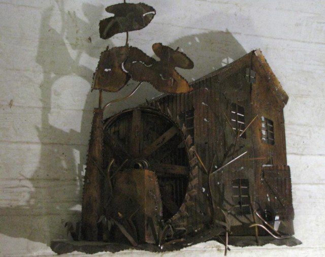 METAL WATERFALL SCULPTURE GRIST MILL: Vintage hammered and soldered wall-hung artwork of a country scene, 24"W X 4"D X 24"H. Naturally variegated patina with lustre and oxidation, ready for immediate installation.