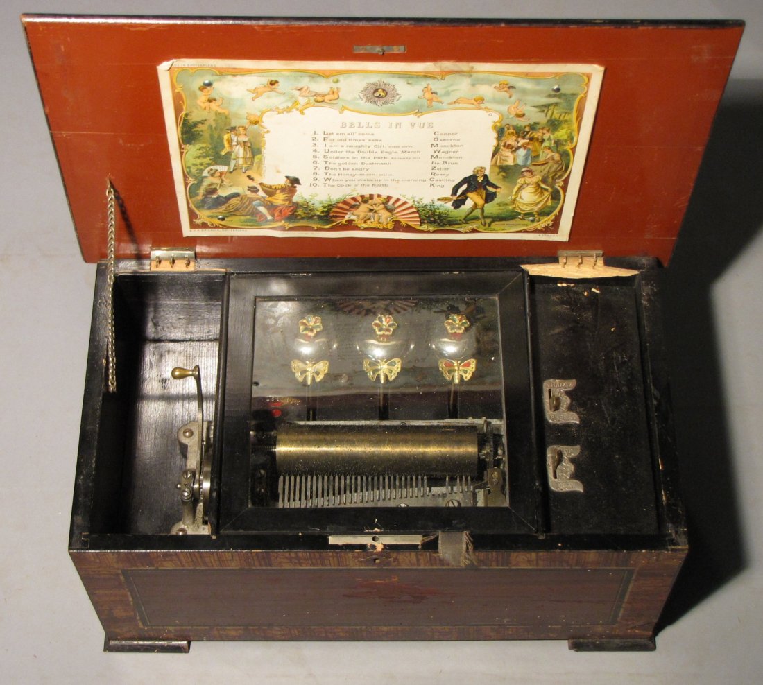 ANTIQUE SWITZERLAND MUSIC BOX: Probably from the latter half of the 1800s; though potentially from the early 1900s. Lid hinges are blown out; mechanics remain present (though untested) & some small pieces of the wood, around the hi