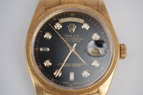 18kt Mans Presidential Rolex Watch: Rolex, Gentleman's, 18kt Presidential, Black Dial. circa 1990's. Day, date and diamond numbers. With papers. In good condition.