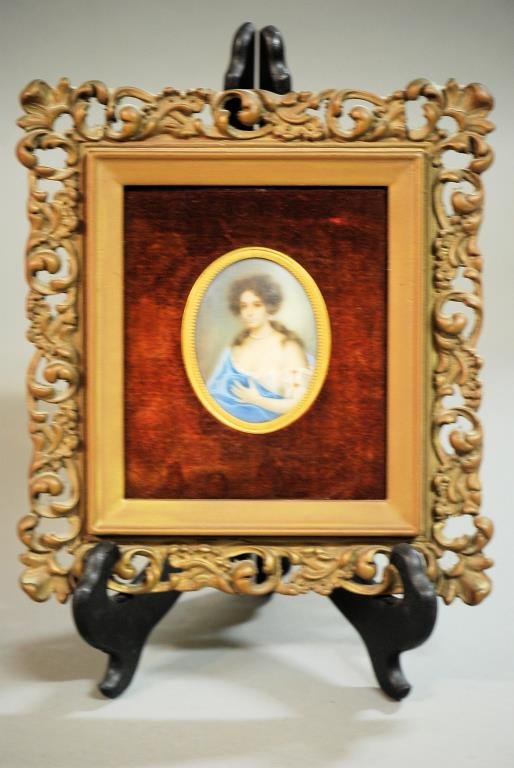 Continental Portrait Plaque: Continental Portrait Plaque. Oval hand painted plaque of an 18th century woman in blue. Signed "Mignard". In a rococo style rectangular frame. 10"H X 9"W X 1"D. In good condition.