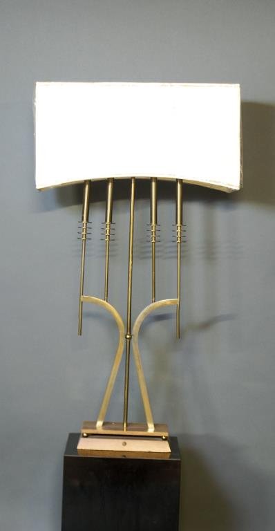 Tommi Parzinger Lamp: Tommi Parzinger Lamp. Original brass on a wooden base, accompanied by the original shade. Removed from a Rittenhouse Square Apartment. Unsigned. 46"H X 25"W X 10"D.