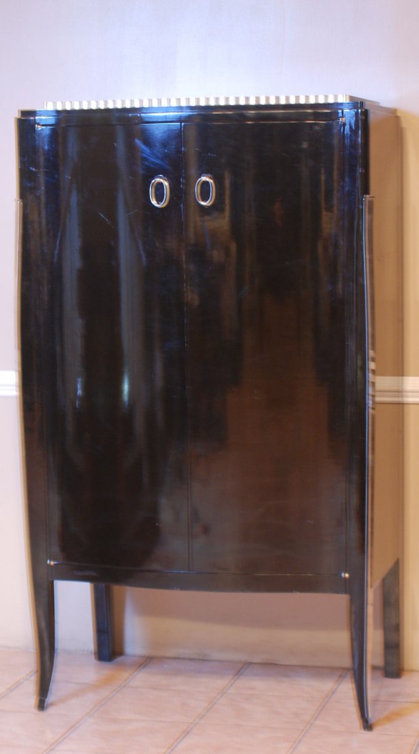 Art Deco Style Cabinet: Art Deco Style Cabinet In The Manner of Ruhlman. Ebonized with silver leaf highlights, chrome trim and handles. 69"H X 37"W X 21 1/2"D. In good condition.