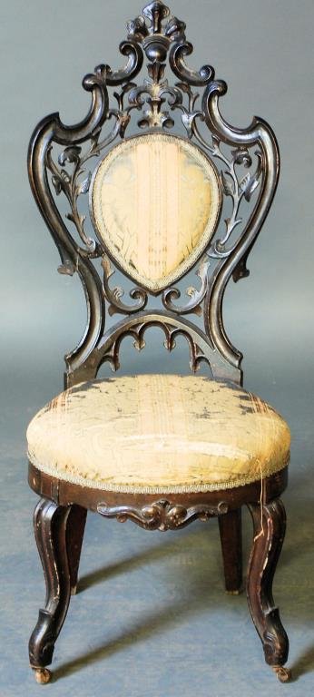 American Victorian Slipper Chair: American Victorian Slipper Chair. Carved walnut with pierced back. Wear to the fabric. Old repairs. 39"H X 16"W X 20"D. In good condition.