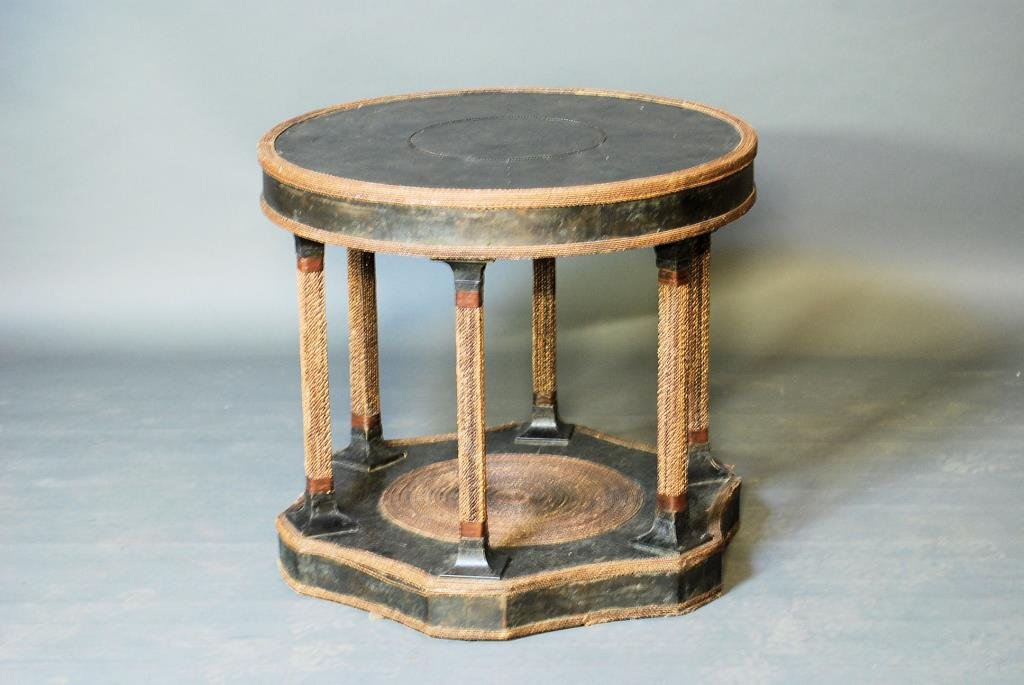 Maitland-Smith Center Table: Maitland-Smith Center Table. Textured bronze clad table with rope twist accents. 27"H X 30" Diameter. In good condition.