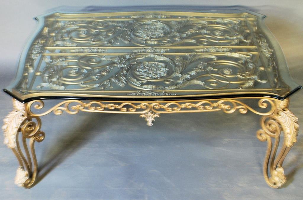 Maitland-Smith Louis XV Style Coffee Table: Maitland-Smith Louis XV Style Coffee Table. Gilt metal ornate base with plate glass top, unlabeled. 21 1/2"H X 53"W X 42 1/2"D. In good condition.
