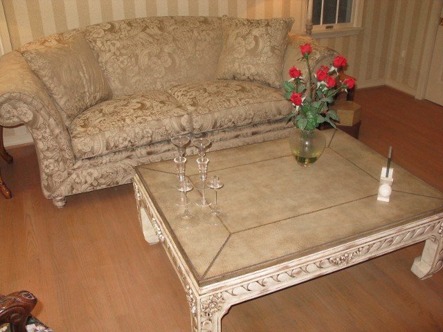 Maitland-Smith Louis XVI Style Coffee Table: Maitland-Smith Louis XVI Style Coffee Table. Distressed cream painted wood frame with tooled leather top, unlabeled. In good condition.