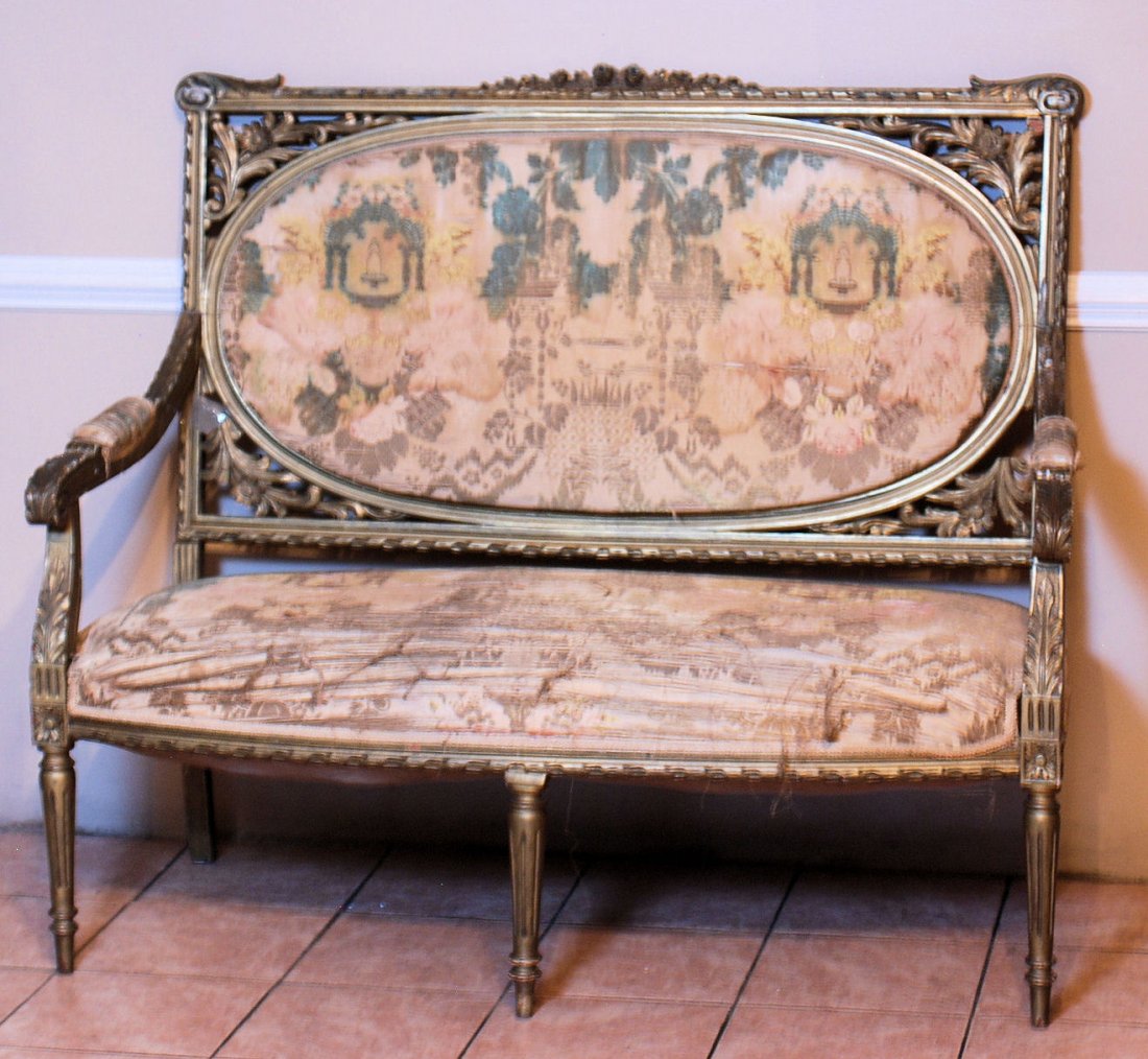 Louis XVI Style Settee: Louis XVI Style Settee. Carved, distressed gilt wood Settee with distressed fabric and minor losses. 45 1/2"H X 52 1/2"W X 28"D. In good condition.