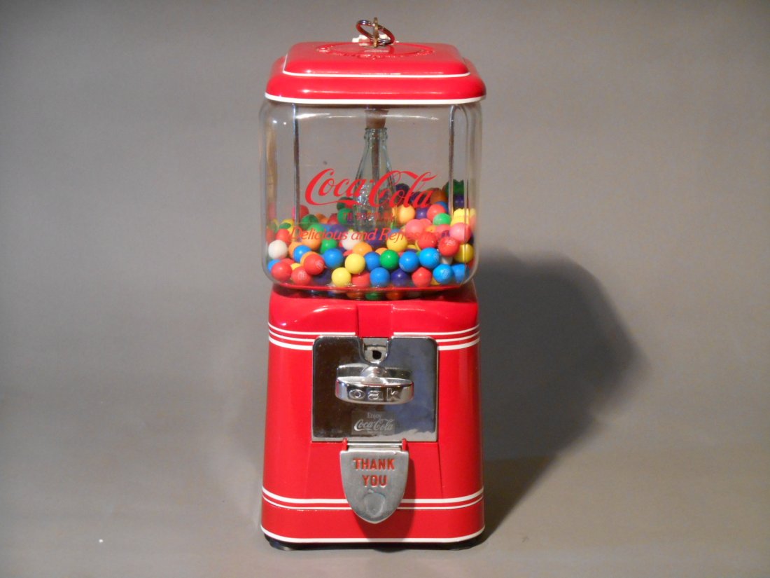 Coca Cola Gumball Machine: Vintage 1950’s-1960’s Oak Mfg. Co. Acorn model Coca Cola themed 14” x 5 ¼” x 6” one cent gumball machine with key.