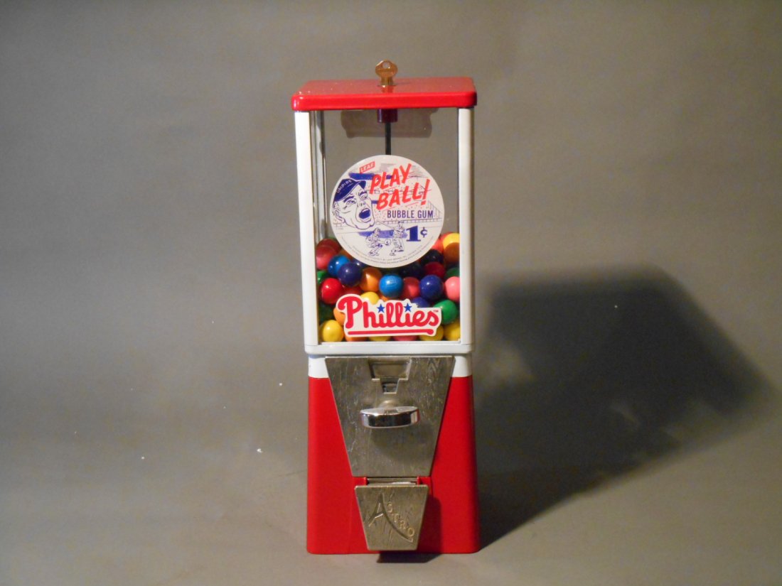 Phila. Phillies Gumball Machine: Vintage 1950’s-1960’s Oak Mfg. Co. Vista model Philadelphia Phillies themed 17” x 6” x 6” one cent gumball machine with key.