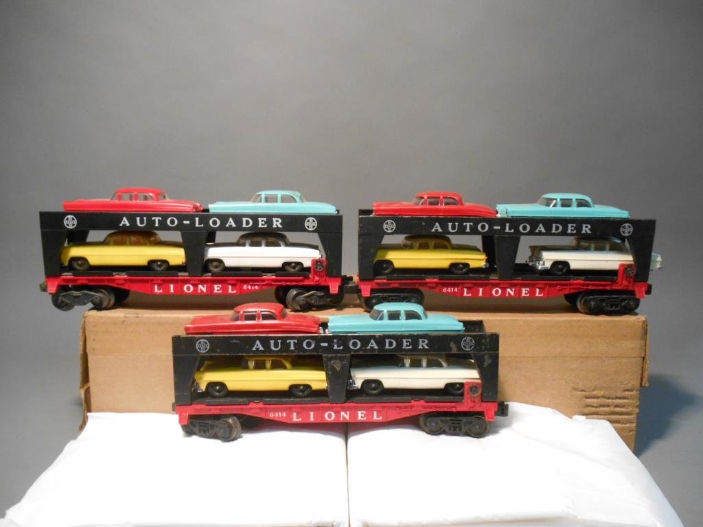 Lionel Evans Auto Loaders: Lot of three Lionel post war O gauge #6414 Evens auto loaders with original blue, white, red & yellow plastic cars.