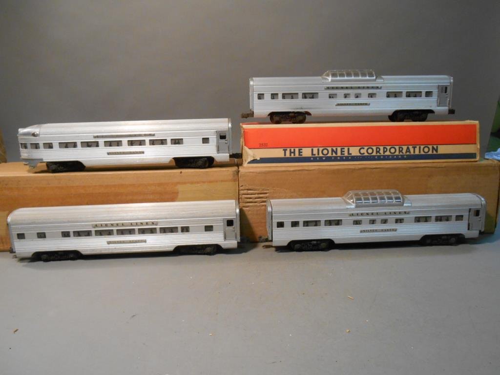 Lionel Passenger Cars: Lot of four Lionel postwar O gauge aluminum passenger cars includes: #2531 Silver Dawn observation car, (2) #2532 Silver Range vista dome cars & #2534 Silver Bluff Pullman car. 1 vista dome comes with