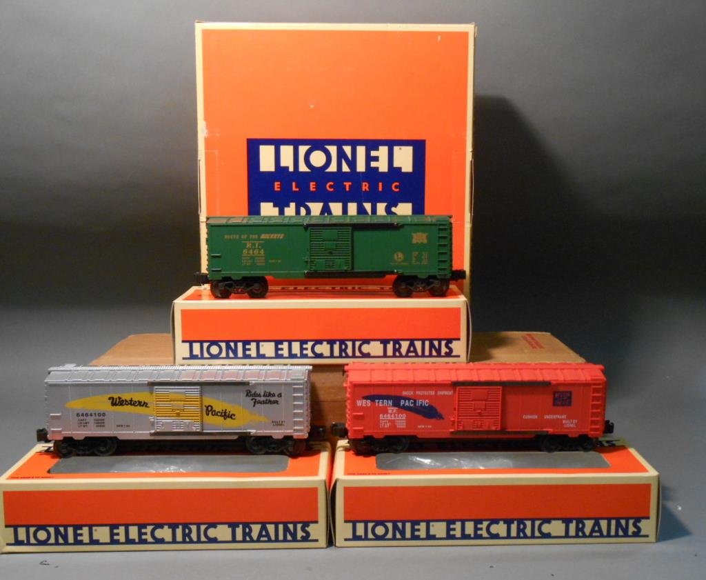 Lionel 6464 Series Boxcars: Lionel modern era O gauge #19257 "6464" series 2 boxcar set of 3 includes: #6464-100 Western Pacific silver/yellow (6-19259), #6464-100 Western Pacific orange/blue (6-19260), & #6464 Rock Island (6-19