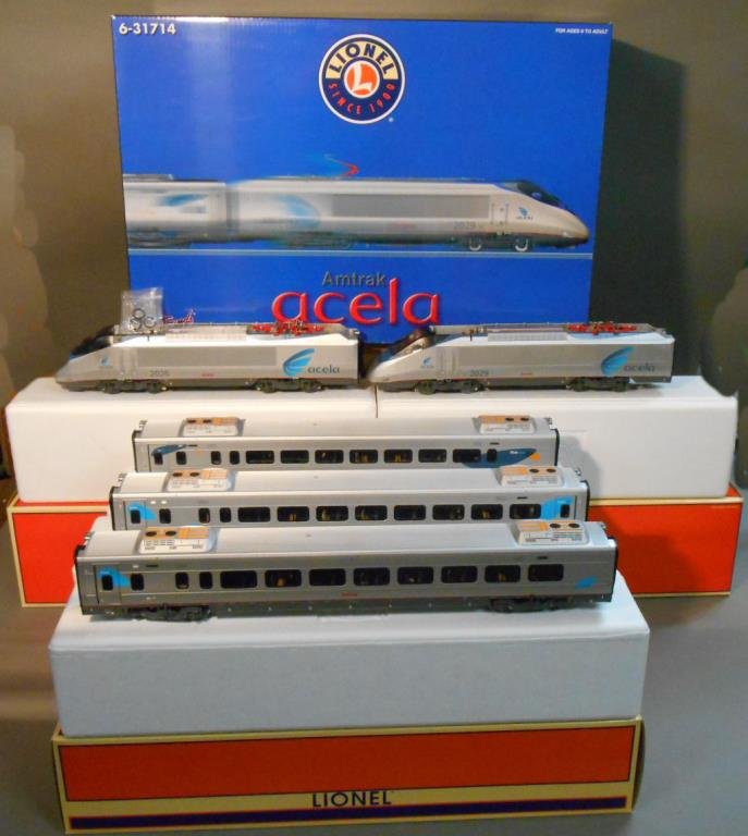 Lionel Amtrak Acela Set: Lionel modern era O gauge #31714 Amtrak Acela passenger set includes: #18357 “2026” powered locomotive, #18358 “2029” non-powered locomotive, #15587 “3405” business class end coach car, #1