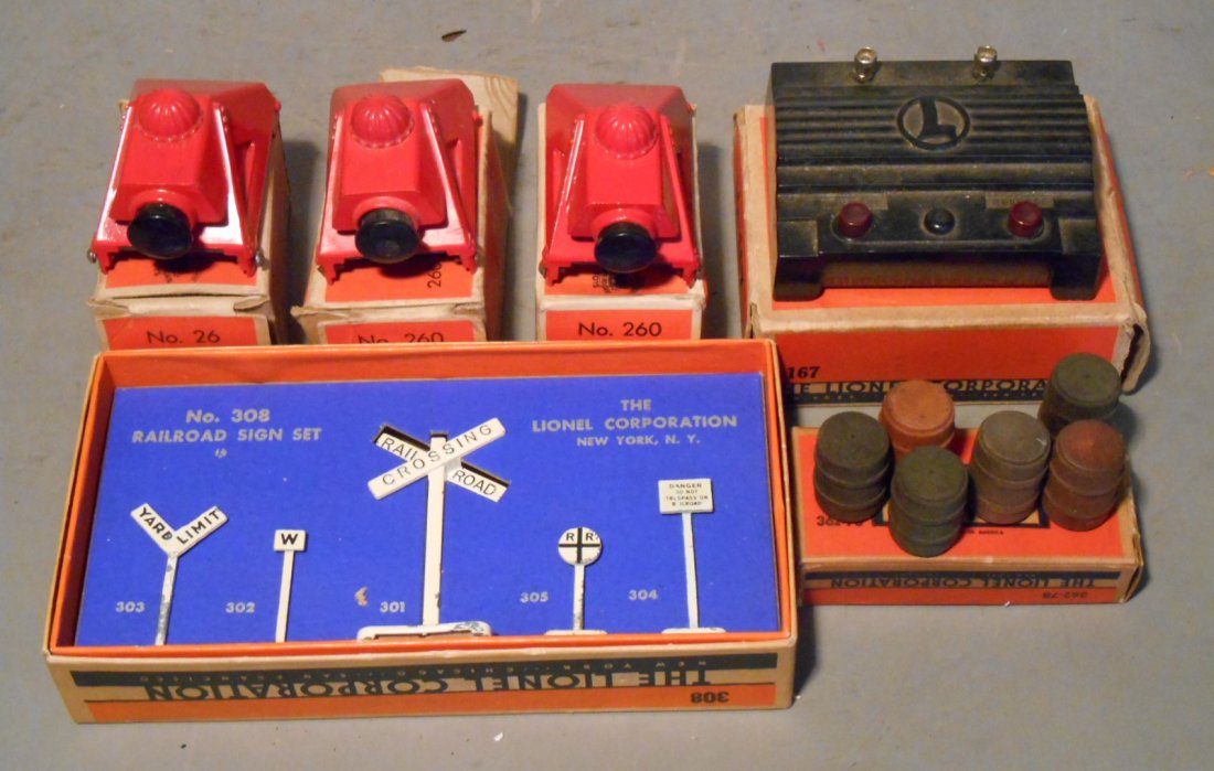 Lionel Train Accessories: Lot of Lionel prewar & postwar train accessories includes: #167 Whistle Controller, (3) #260 Illuminated Bumper, #308 Railroad Sign set & #362-78 set of six Barrels. All come with their original boxes