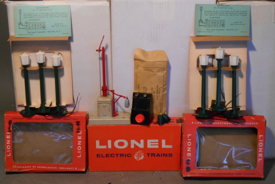 Lionel Train Accessories: Lot of three Lionel postwar O gauge train accessories includes: (2) #76 set of three Boulevard Lamps & #161 Mail Pick-Up set. All come with their original boxes.