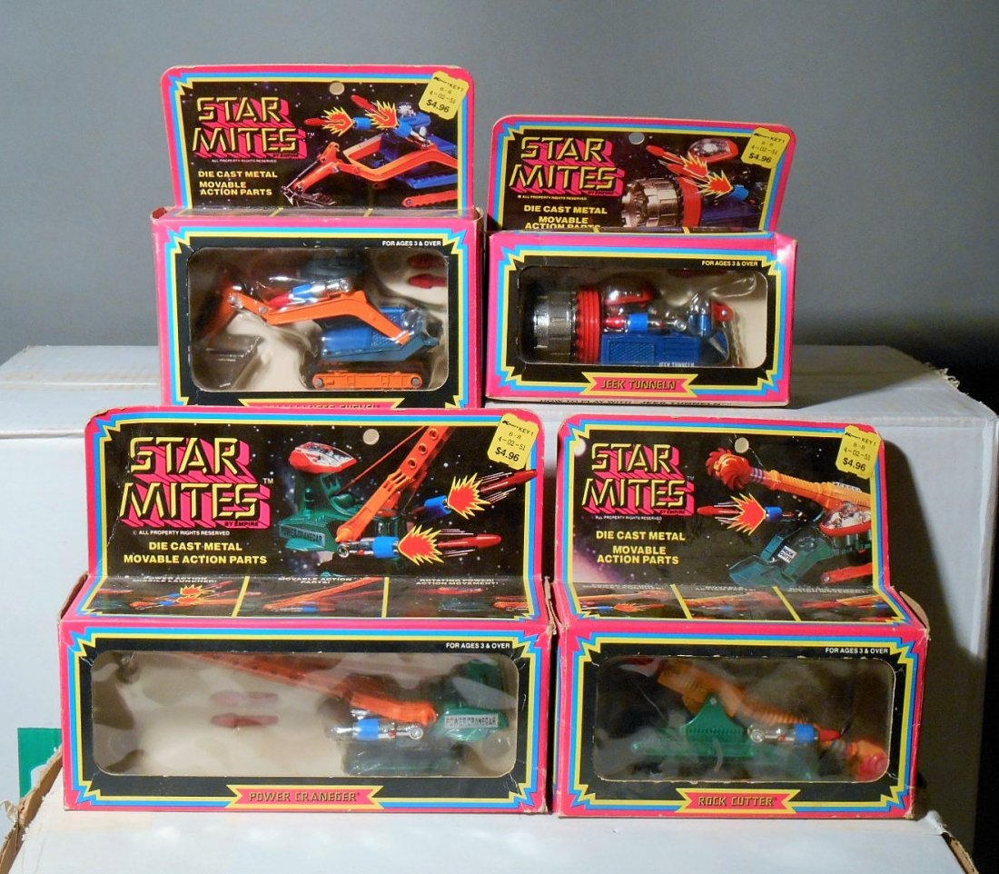 Empire Toys Star Mites: Lot of four 1978 Empire Toys Star Mites die cast robot construction vehicles includes: Commander Shovel, Jeek Tunneln, Power Craneger & Rock Cutter. All come with their original boxes.