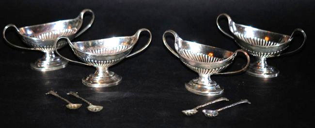 4 SS English Salts: Urn form each having a spoon. All in a presentation case. They are hallmarked "CSH". Charles Stuart Harris , London 1885. 7 TOZ. In good condition.