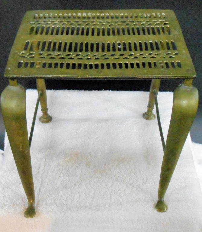 19th c. English Brass Trivet Stand: Mid to late 19th c. English brass 8 ½” (h) x 8 ½” (l) x 9” (w) trivet stand. Condition: Areas with some form of wear from age & usage.