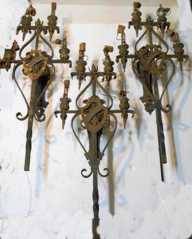 Gothic Style Wrought Iron Wall Sconces: Three 1920’s wrought iron Gothic style 31 ¼” (h) x 14” (l) x 7” (w) four light wall sconces. Condition: All have areas with some form of patina wear & or loss. All need to be re-wired.